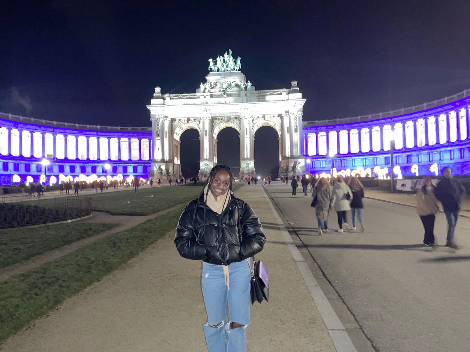 Natalie France poses in Brussels city center at night